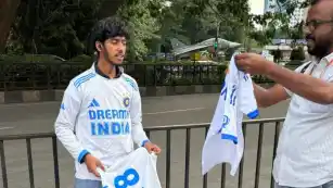 Virat Kohli in white jersey at M Chinnaswamy stadium