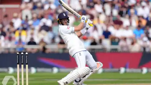 Joe Root celebrates record century.
