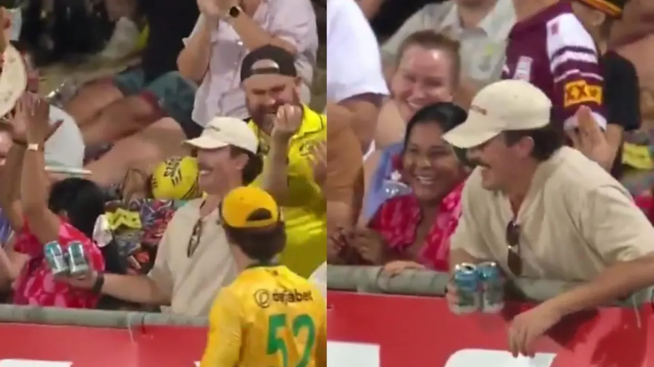 Spectator holds Best one-handed crowd catch. 