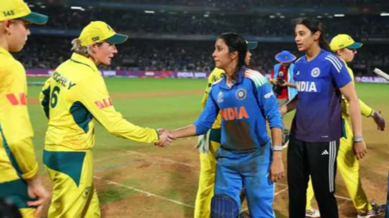 Indian cricketer Jemimah Rodrigues shakes hands with Australian players after a cricket match, showing sportsmanship and mutual respect on the field.
