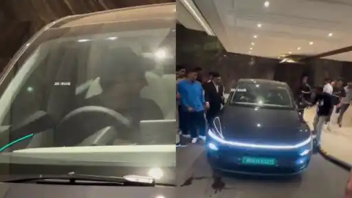 Rohit Sharma drives his Tesla car in Mumbai.