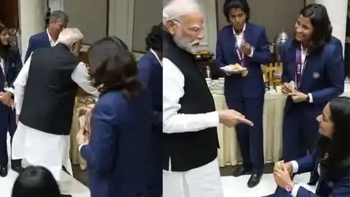 PM Narendra Modi serves food to injured Pratika Rawal during meeting.
