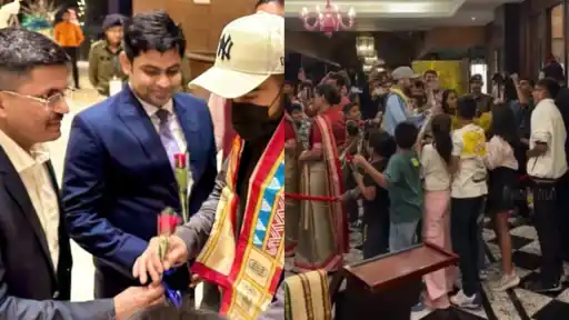 Kids welcome Virat Kohli with roses.
