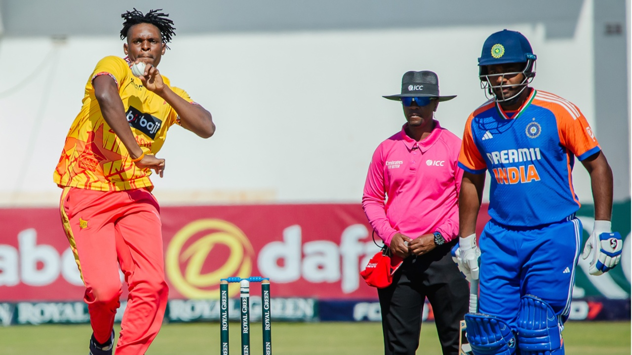 Richard Ngarava bowls during a T20I as Sanju Samson sees the striker. 