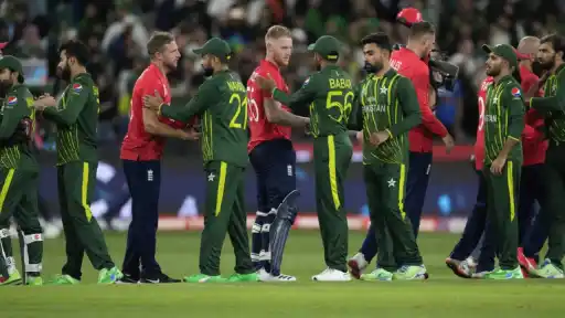 England and Pakistan players congratulating each other. 