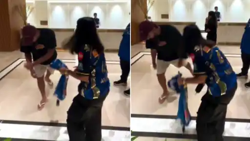 Rohit Sharma reacts as a female fan attempts to touch his feet