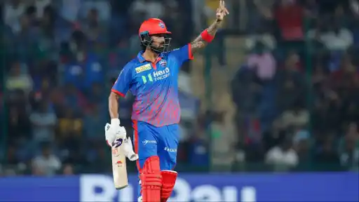 KL Rahul raising his bat in celebration at Arun Jaitley Stadium Delhi after DC vs RR IPL 2026 — now closing in on Virat Kohli's record for most 500-run seasons in IPL history