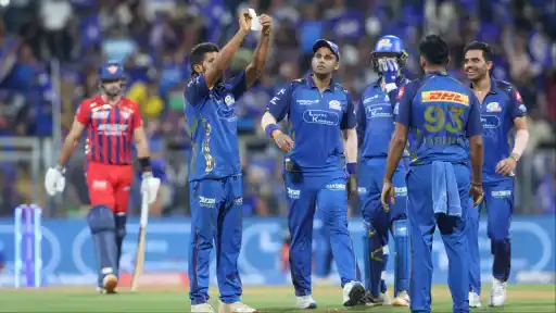 Raghu Sharma celebrates maiden wicket