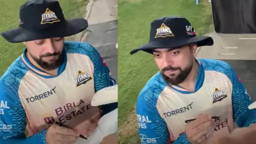 Rashid Khan laughing after misunderstanding a fan's 5-for prediction as pipe kharab while signing autographs ahead of GT vs CSK IPL 2026
