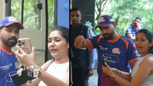 Rohit Sharma smiling and waiting for a fan whose phone switched off — pre-match fan interaction ahead of RCB vs MI IPL 2026 Match 54