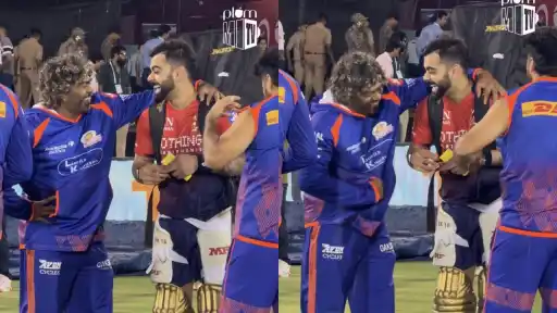 Virat Kohli and Lasith Malinga talking and smiling during rain break at Shaheed Veer Narayan Singh International Stadium — IPL 2026