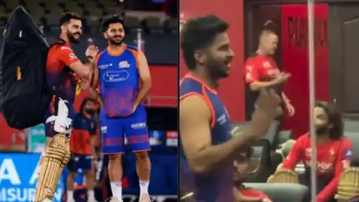 Virat Kohli and Shardul Thakur smiling and talking inside the RCB dressing room at Shaheed Veer Narayan Singh International Stadium, Raipur — IPL 2026 Match 54