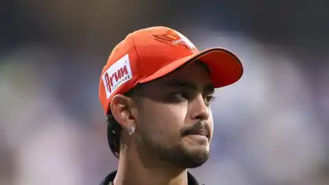 Ishan Kishan presenting 6 pairs of Adidas cricket shoes to Sunrisers Hyderabad player Sakib Hussain after IPL 2026 playoff elimination
