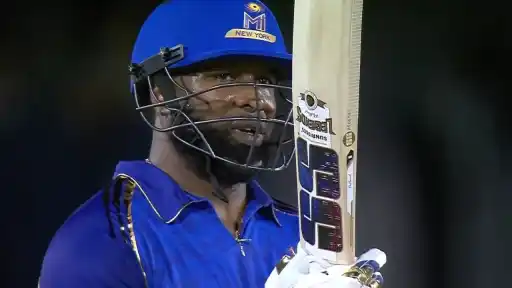 Kieron Pollard celebrating his century for MI New York against Washington Freedom in MLC 2026 after surpassing Chris Gayle as T20 cricket's all-time highest run-scorer