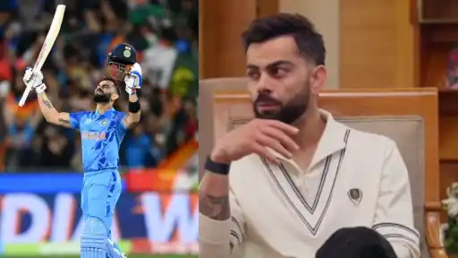 Virat Kohli raises his bat skyward after India beat Pakistan in the T20 World Cup 2022 at the MCG, with "INDIA WIN" on the giant screen behind him