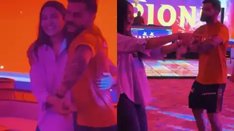 Virat Kohli and Anushka Sharma dancing together on the floor celebrating RCB's IPL 2026 championship win over GT
