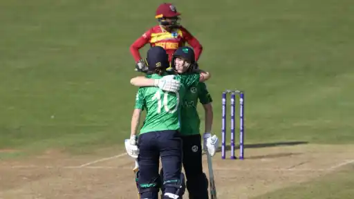 Two Ireland batters embracing on the pitch in celebration after their historic win over West Indies at the Women's T20 World Cup 2026