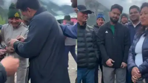 Rishabh Pant signing autographs and posing for photos with fans in the mountains of Uttarakhand during his surprise temple visit