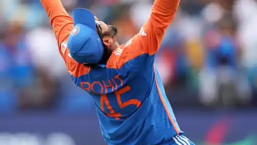 Rohit Sharma celebrating with arms raised in his India jersey, marking the anniversary of his international debut and career rise