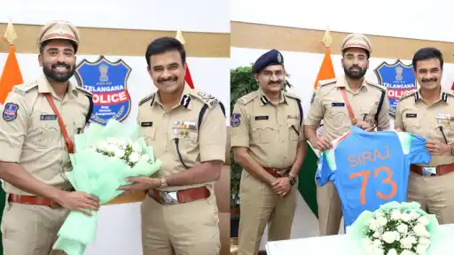 DSP and Indian cricketer Mohammed Siraj gifting a Team India jersey to Telangana DGP CV Anand in Hyderabad