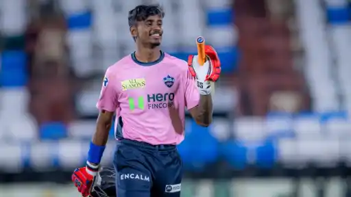Abhishek Porel of Delhi Capitals smiling on the field, ahead of Calcutta High Court's arrest order in the case against him