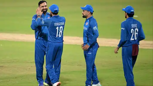 Afghanistan players celebrate a wicket during a match, as the team names its 15-member squad for the T20I series against India