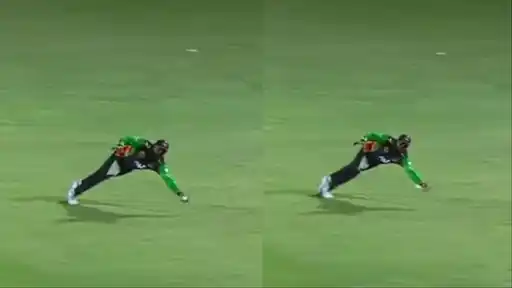 Wanindu Hasaranga dives low to complete a one-handed catch to dismiss Usman Khan in the Jamaica Kingsmen vs St Kitts and Nevis Patriots CPL 2026 match