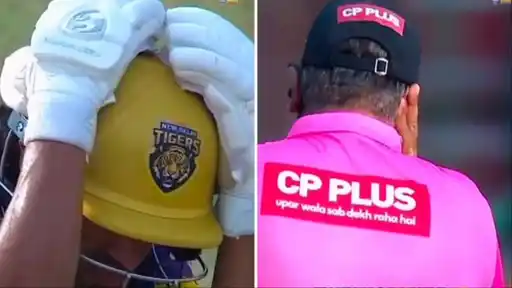 New Delhi Tigers batter reacts in shock as the umpire holds his face after being struck by Lakshay Thareja's shot in DPL 2026