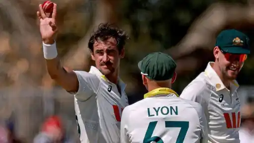 Mitchell Starc holding up the ball to celebrate his five-wicket haul in 22 balls as Bangladesh were bowled out for 64 in the AUS vs BAN 2nd Test