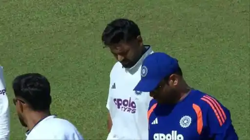 Rishabh Pant walking off the field with his head down, being escorted by the India support staff after retiring hurt with a wrist injury vs Sri Lanka