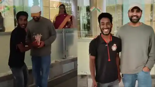 Rohit Sharma poses with a fan who cycled all the way from Odisha to Mumbai to meet his idol