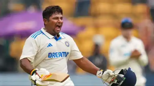 Sarfaraz Khan celebrates in Team India whites after scoring a century, pictured following his cryptic post over the Test squad snub for the SL series