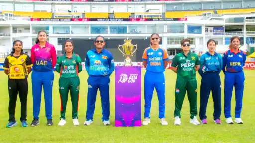 Captains of all 8 Women's Asia Cup teams, including India and Pakistan, pose with the trophy