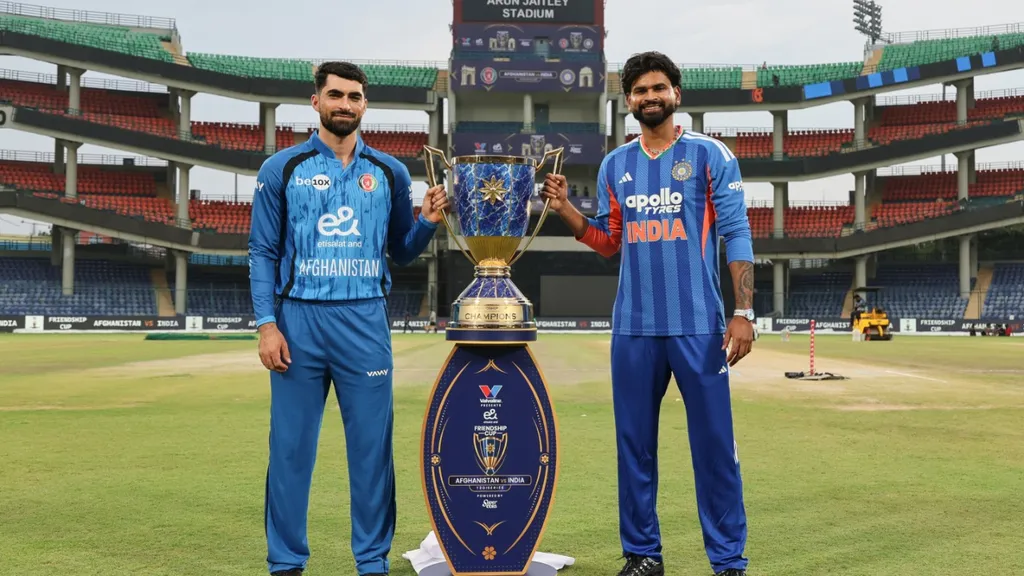 India and Afghanistan captains pose with the series trophy ahead of the 1st T20I at Arun Jaitley Stadium, Delhi, amid weather concerns for the match
