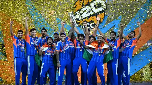 India's T20 World Cup-winning team celebrating with the trophy, as BCCI explores an India XI vs Rest of the World XI centenary match