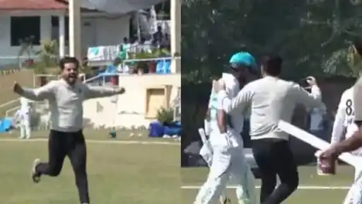 Fan runs onto the field to take a selfie with Babar Azam during the President's Trophy Grade 1 match
