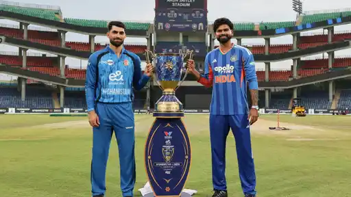 India and Afghanistan captains pose with the series trophy ahead of the 1st T20I at Arun Jaitley Stadium, Delhi, amid weather concerns for the match