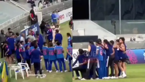 Indian players huddle together on the field celebrating their Women's Asia Cup 2026 win, improvising with a water bottle in place of the trophy