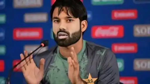 Mohammad Rizwan gestures while speaking at a press conference in Pakistan kit