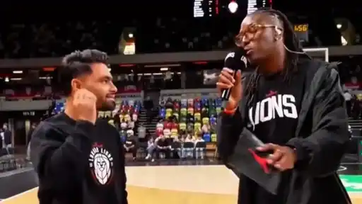 Rinku Singh shares a hilarious exchange with the London Lions courtside host during a British Basketball League game at Copper Box Arena in London