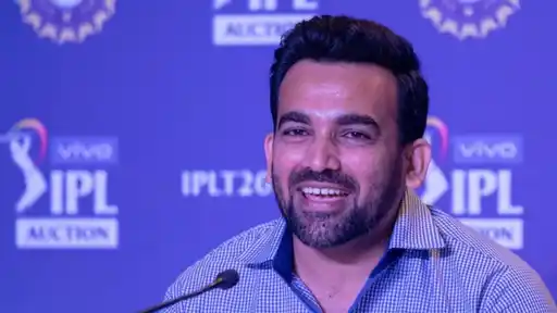 Zaheer Khan smiles at a microphone in front of an IPL Auction backdrop, named Chennai Super Kings head coach ahead of IPL 2027