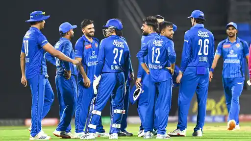 Afghanistan players celebrate winning the UAE ODI Tri-Series after beating Zimbabwe by seven wickets in the final at Sharjah