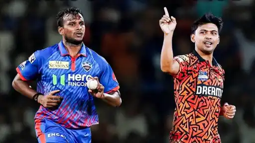 T. Natarajan in Sunrisers Hyderabad orange kit celebrating a wicket alongside teammates during an IPL match