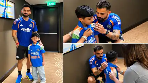 Virat Kohli signs an India shirt for a young fan wearing a matching India kit ahead of the IND vs WI T20I series