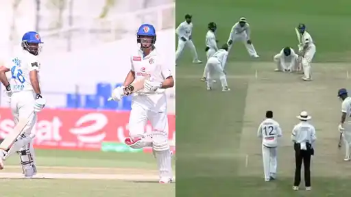 Two Afghanistan batters in white kit and blue helmets run between the wickets, beside a close-in Bangladesh fielding ring crowding a batter.