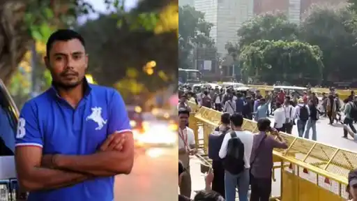 Danish Kaneria in a blue polo shirt with his arms crossed; on the right, a crowd of protesters and onlookers beside yellow police barricades on a road in New Delhi during the CJP protest.