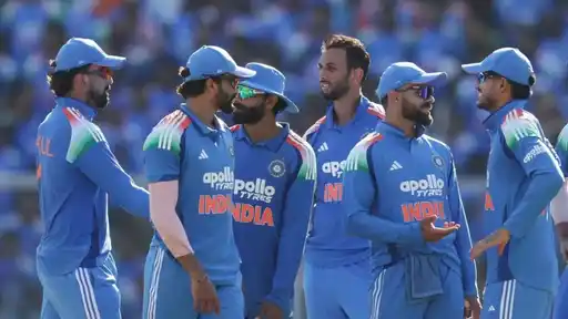 Group of India players in blue ODI kit and caps huddle together on the field, illustrating India's full schedule for the ICC Men's ODI World Cup 2027