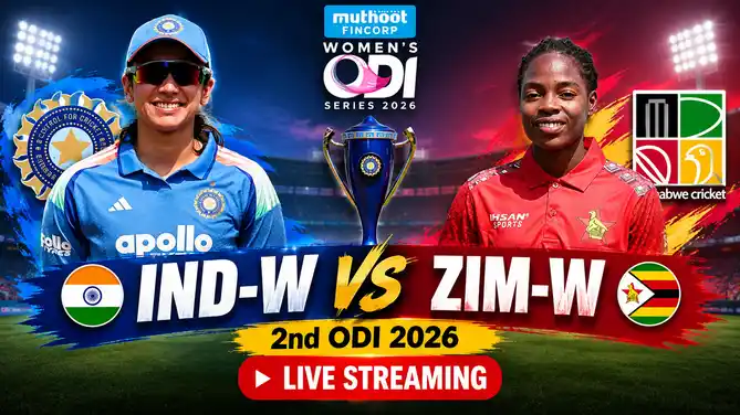 India Women player in blue and a Zimbabwe Women player in red, with a trophy