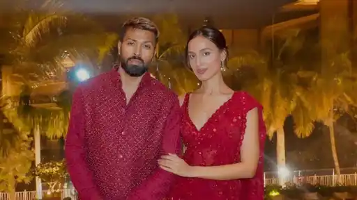 Hardik Pandya stands beside Mahieka Sharma