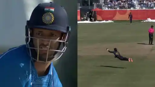 India batter in helmet and blue kit beside a fielder in dark kit diving full stretch to take a one-handed catch during the Asian Games 2026 semifinal